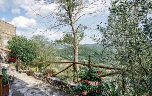 a garden with flowers and a wooden fence at C'era Una Volta In Mlaterone in Montelaterone
