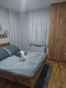 Postel nebo postele na pokoji v ubytování Apartman Pavle