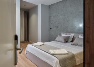 Postel nebo postele na pokoji v ubytování Montflux Hotel