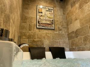 a room with two chairs and a poster on the wall at Haut Charmes de Cornil in Cornil