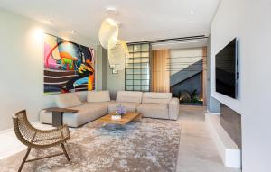 a living room with a couch and a tv at Pet Friendly Home In Rukavac With Sauna in Rukavac