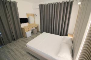 Postel nebo postele na pokoji v ubytování Hotel Ambra