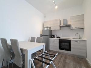 Η κουζίνα ή μικρή κουζίνα στο Catullo Stay Near The Airport