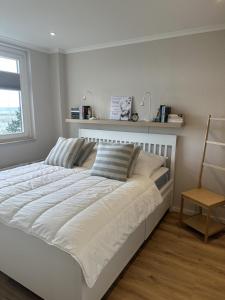 Postel nebo postele na pokoji v ubytování Ferienwohnung Ankerplatz