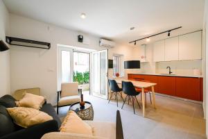 a living room with a couch and a table at House Grisia 33 in Rovinj