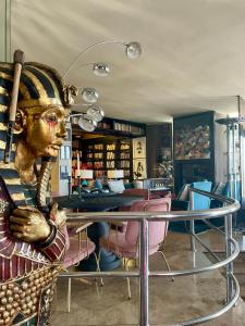 a statue of a person sitting at a table at Marbella Boutique Art suites in Marbella