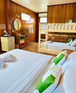 Postel nebo postele na pokoji v ubytování Bann Klong Jao Homestay + 16 fotografií