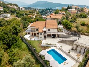 an aerial view of a house with a swimming pool at Albizia in Herceg-Novi