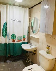 a bathroom with a toilet and a sink and a shower curtain at 1 min from Sadang Station line 2 & 4 in Seoul