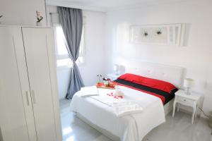 a white bedroom with a bed and a window at Mijas Room A4J in Mijas +26 photos