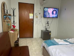 TV a/nebo společenská místnost v ubytování Noot's Guesthouse