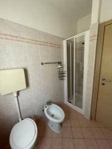 a bathroom with a toilet and a shower at Residence Cascata Varone in Riva del Garda +132 photos