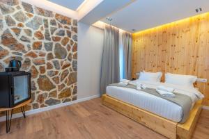 Ένα ή περισσότερα κρεβάτια σε δωμάτιο στο Hotel Jezerca Theth