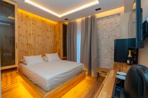 Ένα ή περισσότερα κρεβάτια σε δωμάτιο στο Hotel Jezerca Theth