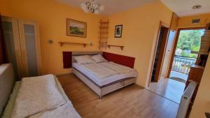 Posteľ alebo postele v izbe v ubytovaní Studio in Balatonlelle 33519