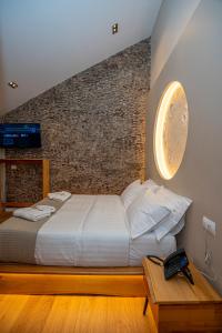Ένα ή περισσότερα κρεβάτια σε δωμάτιο στο Hotel Jezerca Theth