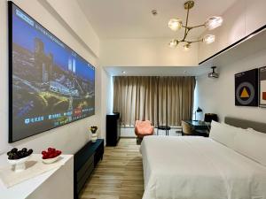 Una cama o camas en una habitación de Golden Central Hotel Serviced Residence-Xin Hao E Du金中环服务公寓新浩e都店