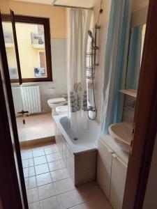 a bathroom with a shower and a sink and a toilet at Casa-Mariella in Porto SantʼElpidio