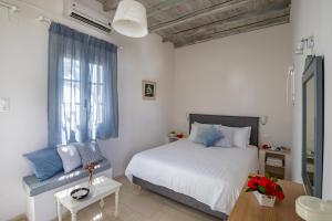 Cama ou camas em um quarto em Olia Hotel