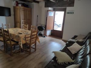 a living room with a table and a couch at Palacio de Aralar Terracita in Oskotz