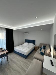 Postel nebo postele na pokoji v ubytování IO's Apartments