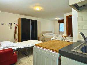 a hospital room with two beds and a sink at Acquatica House - San Siro District in Milan