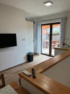 TV a/nebo společenská místnost v ubytování Apartmán pod Pálavou