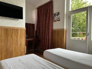 Postel nebo postele na pokoji v ubytování Hotel Isis