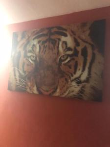 a painting of a tiger on a wall at Josiane Peace of stay in Miami