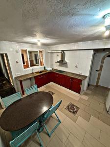 a kitchen with a table and chairs in a room at Casa Amparo in Jávea