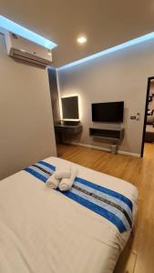 Postel nebo postele na pokoji v ubytování Wonder Hills Pool Villa Pattaya 泳池别墅