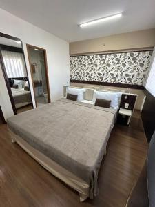 Postel nebo postele na pokoji v ubytování Hotel Mercu Paraiso Beneficência Portuguesa com garagem 1403