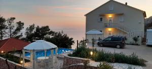 a car parked in a parking lot next to a building at Villa Jagoda in Sveta Nedelja