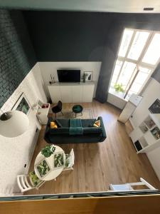 an overhead view of a living room with a couch at Piotrkowska 37 - Green Leaf in Łódź