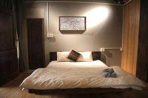 Ein Bett oder Betten in einem Zimmer der Unterkunft Cat Homestay