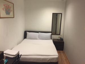 Postel nebo postele na pokoji v ubytování Hotel Conforto + 6 fotografií