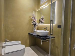 Koupelna v ubytování Gabbiano Suites