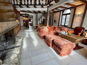 a large living room with couches and a table at WEF 2026 Exclusive 160mq Castle Apartment in Davos -now available again in Davos