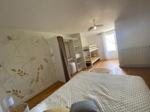 Postel nebo postele na pokoji v ubytování Maison du bonheur