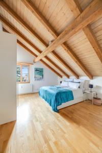 Postel nebo postele na pokoji v ubytování Atemberaubendes Apartment mit Dachterrasse