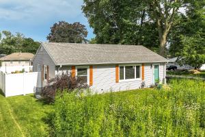 a small house in a field of grass at BeHome Your Cozy, Fun Getaway in Richfield