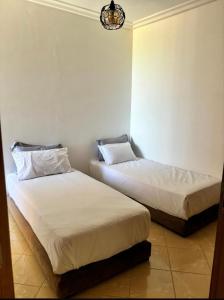 Ένα ή περισσότερα κρεβάτια σε δωμάτιο στο Appartement familial neuf