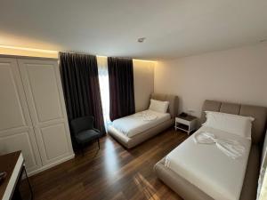 Postel nebo postele na pokoji v ubytování Arberia Palace Hotel