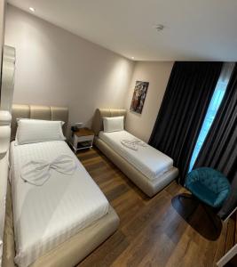 Postel nebo postele na pokoji v ubytování Arberia Palace Hotel
