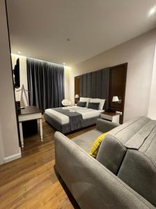 Postel nebo postele na pokoji v ubytování Arberia Palace Hotel
