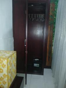 eine Holztür mit einem Kasten davor in der Unterkunft Villa Pool Private and Romantic In Kuta Bali in Kuta