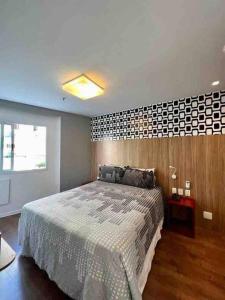 Cama o camas de una habitación en Flat Ipanema com Garagem