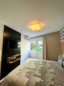 Cama o camas de una habitación en Flat Ipanema com Garagem