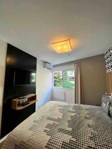Cama o camas de una habitación en Flat Ipanema com Garagem