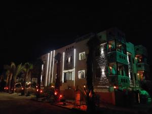 a building with christmas lights on it at night at Villa Silia in Sharm El Sheikh